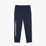 Lacoste Mens Showerproof Stretch Track Pants in Blue material_Synthetic - Size Large