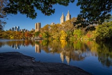 Fall in Central Park at The Lake Cityscape sunrise view with colorful Autumn foliage on the Upper West Side Manhattan New York City