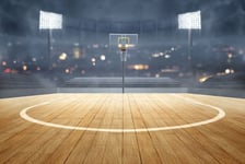 Basketball court with wooden floor lights reflectors and tribune