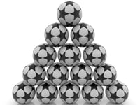 Pyramid of soccer balls with black stars