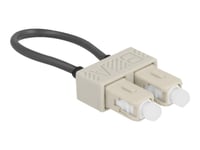 Delock - Loopback-Adapter - Sc-Läge (Multi-Mode) (Hane) - Fiberoptisk - 50/125 Mikron - Om2 - Grå, Beige