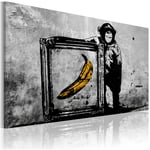 Décoshop26 - Tableau sur toile décoration murale image imprimée cadre en bois à suspendre Inspiré de Banksy - noir et blanc 120x80 cm