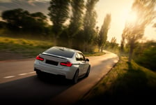 Fast Car on Empty Road