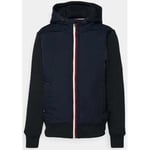 Manteau Tommy Hilfiger  Veste bi-matière à capuche  marine en coton bio