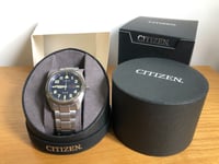 Citizen Men's Eco-Drive Super Titanium Date Bracelet Strap Watch, Silver/Blue