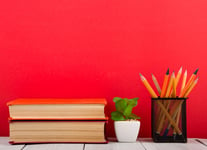 Education and wisdom concept - open book on wooden table color background