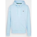 Polaire Lacoste  Sweat zippé à capuche  bleu clair