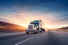 American style truck on freeway pulling load Transportation the