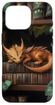 Coque pour iPhone 16 Pro Petit dragon endormi sur une bibliothèque