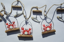 Shoeless Joe nautical garland with little orange crabs and shiny silver fish.