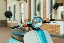 Close up view retro scooter parked on city street