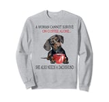 A woman cannot survive on coffee alone dachshund Sweatshirt