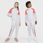 The Nike Sportswear Tracksuit includes a full-zip jacket and trousers made from nylon fabric. This lightweight shell gives you sporty look that is as fun it classic. Lightweight Coverage Nylon fabric durable for all-day coverage. Versatility Mix match your with these separates. Older Kids' Woven - Grey