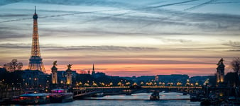 Paris cityscape with Tour Eiffel and Pont Alexandre III at twilight