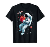 An Astronaut Is Floating in Space Station, Holding Gifts T-Shirt