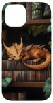 Coque pour iPhone 14 Petit dragon endormi sur une bibliothèque