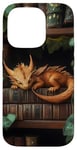 Coque pour iPhone 14 Pro Petit dragon endormi sur une bibliothèque