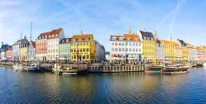 Nyhavn with its picturesque harbor and colorful facades of old houses in Copenhagen Denmark