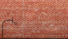 Basketball Hoop - Unique basketball hoop shadow in front of brick wall