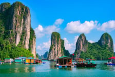 Floating fishing village and rock island in Halong Bay Vietnam Southeast Asia UNESCO World Heritage Site Junk boat cruise to Ha Long Bay Landscape Popular landmark famous destination of Vietnam