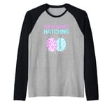 Gender Reveal Guess What's Hatching Pink And Blue Easter Egg Raglan Baseball Tee