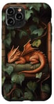 Coque pour iPhone 11 Pro Petit dragon endormi sur une bibliothèque avec des vignes