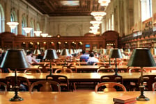 Books on the table in the reading room in the library