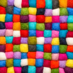 Color wool background - balls of syntetic wool yarn - geometric rainbow pattern