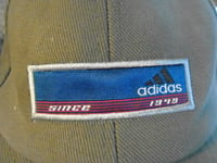 NEW ADIDAS  PEAK CAPS ~ PACK OF TWO ~ ONE SIZE FITS ALL~1 NAVY BLUE/1 ARMY GREEN