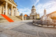 Viiew on the Gendarmenmarkt square with concert house building and French cathedral during the morning light in Berlin city