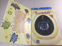 New Bandai Original TamaGotchi Blue Black letters, 1996 - 1997 English