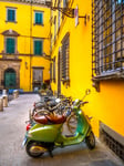 European motorbikes scooters vespas parked in Lucca Italy